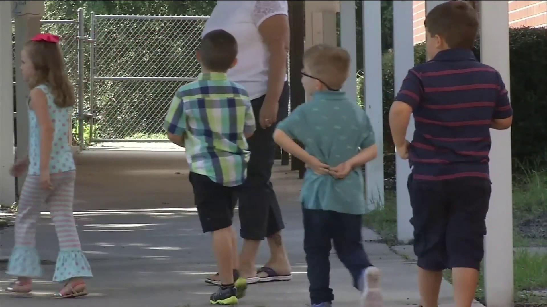 children walking in a straight line