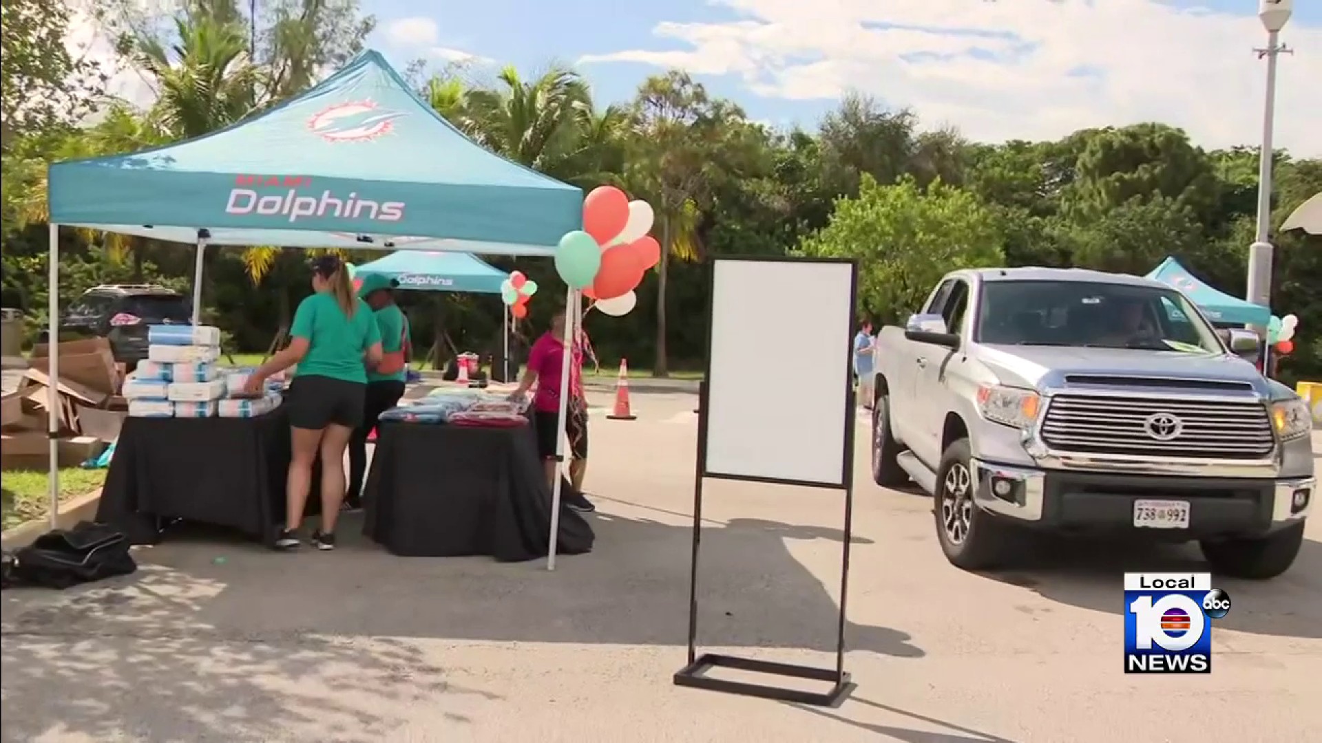 Miami Dolphins hold drive-thru baby shower for expectant mothers who are  veterans