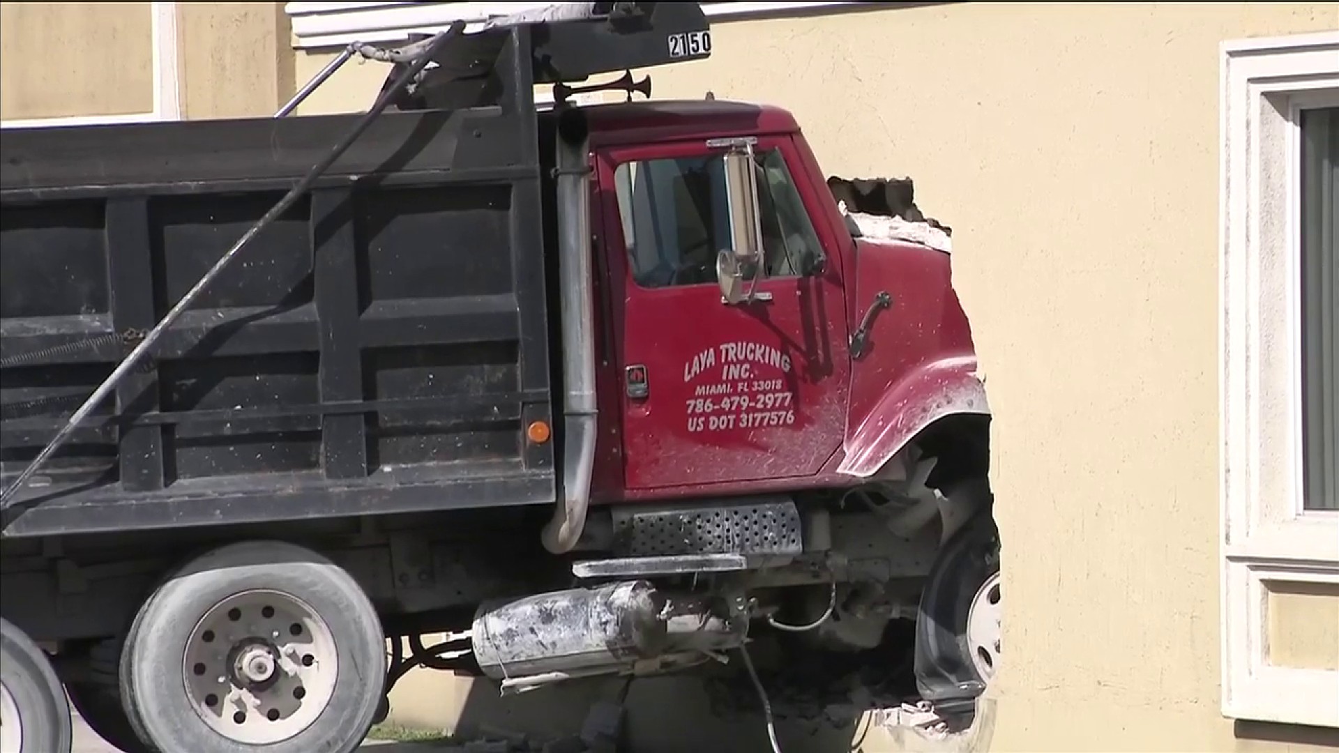 Dump Truck Crashes Into Building In Southwest Miami Dade